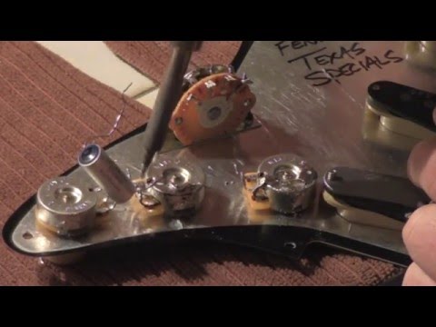 How to wire your stratocaster, test pots, select capacitor and make tone control wiring decisions.