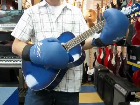 playing guitar with boxing gloves
